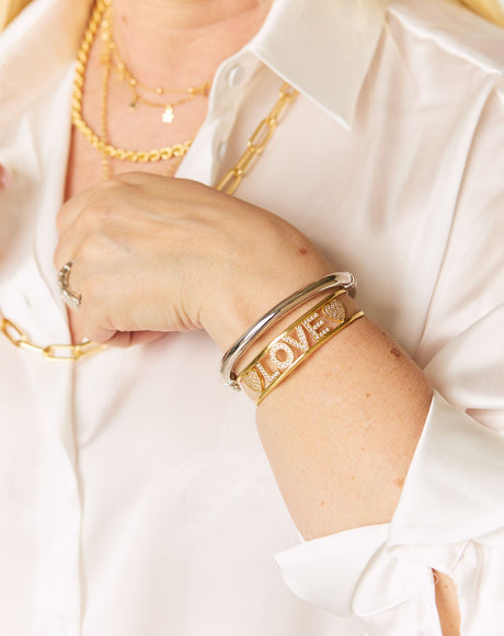 Carmen wearing the Love Bangle stacked with the Colosseum Silver Bangle.