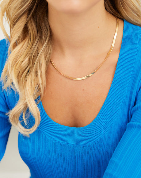 Model wearing our Oro Gold Herringbone Chain "Liquid Gold" Necklace.